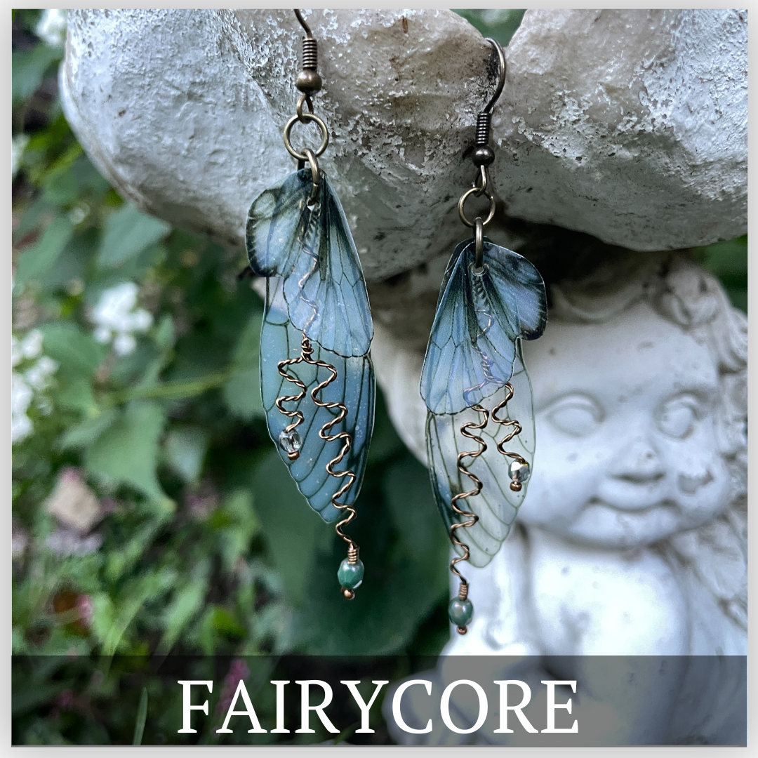 Transparent butterfly wing earrings with brown accents with copper wires and copper crystals.