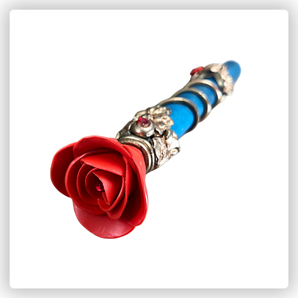 Touchscreen stylus with polymer clay red rose and gold details with red crystals.