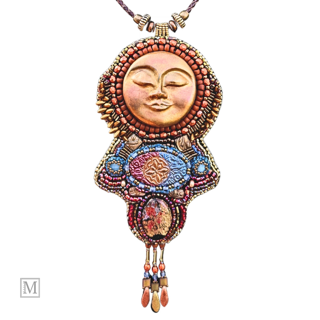 Colorful beaded sun pendant with face design on a white background