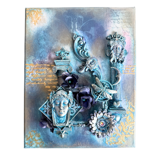 Decorative wall art with ornate faces, flowers, and decorative elements on a textured background.