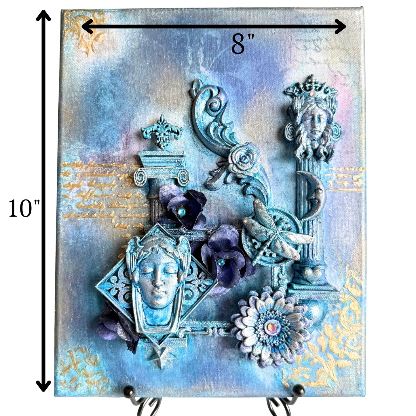 Decorative wall art with intricate designs, flowers, and a face-like figure on a textured background.