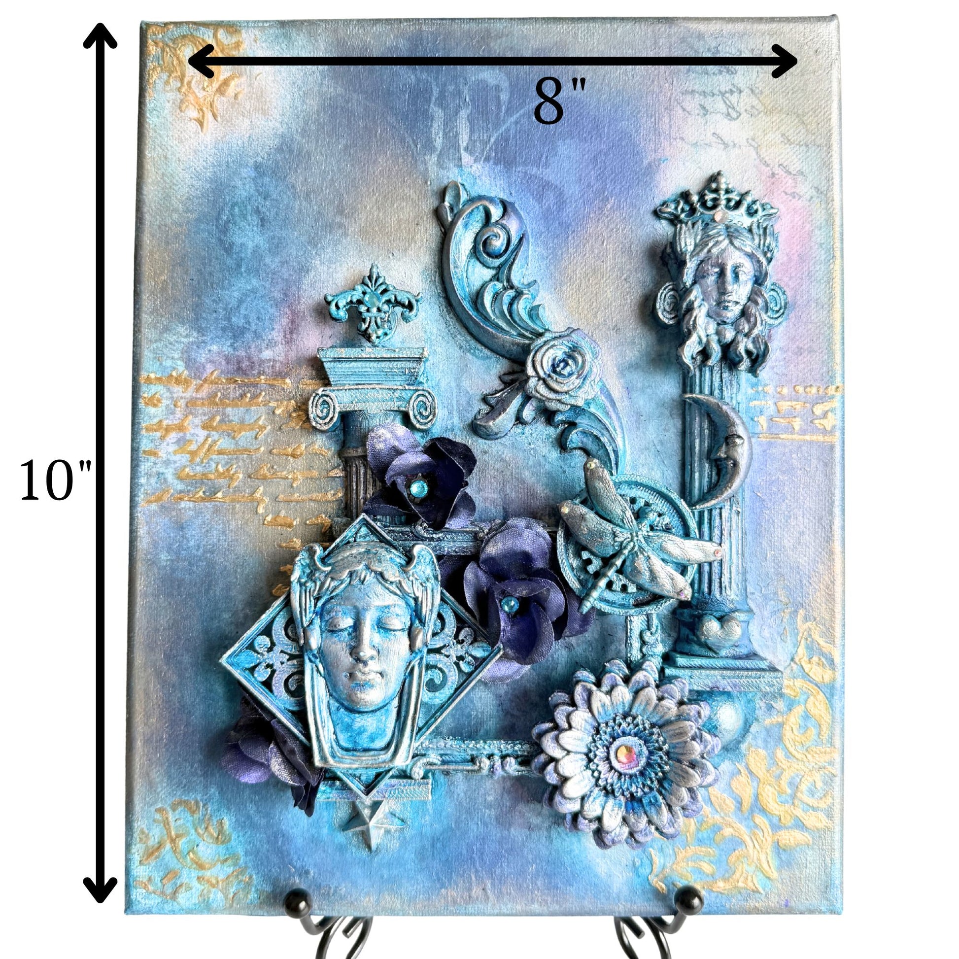 Decorative wall art with intricate designs, flowers, and a face-like figure on a textured background.