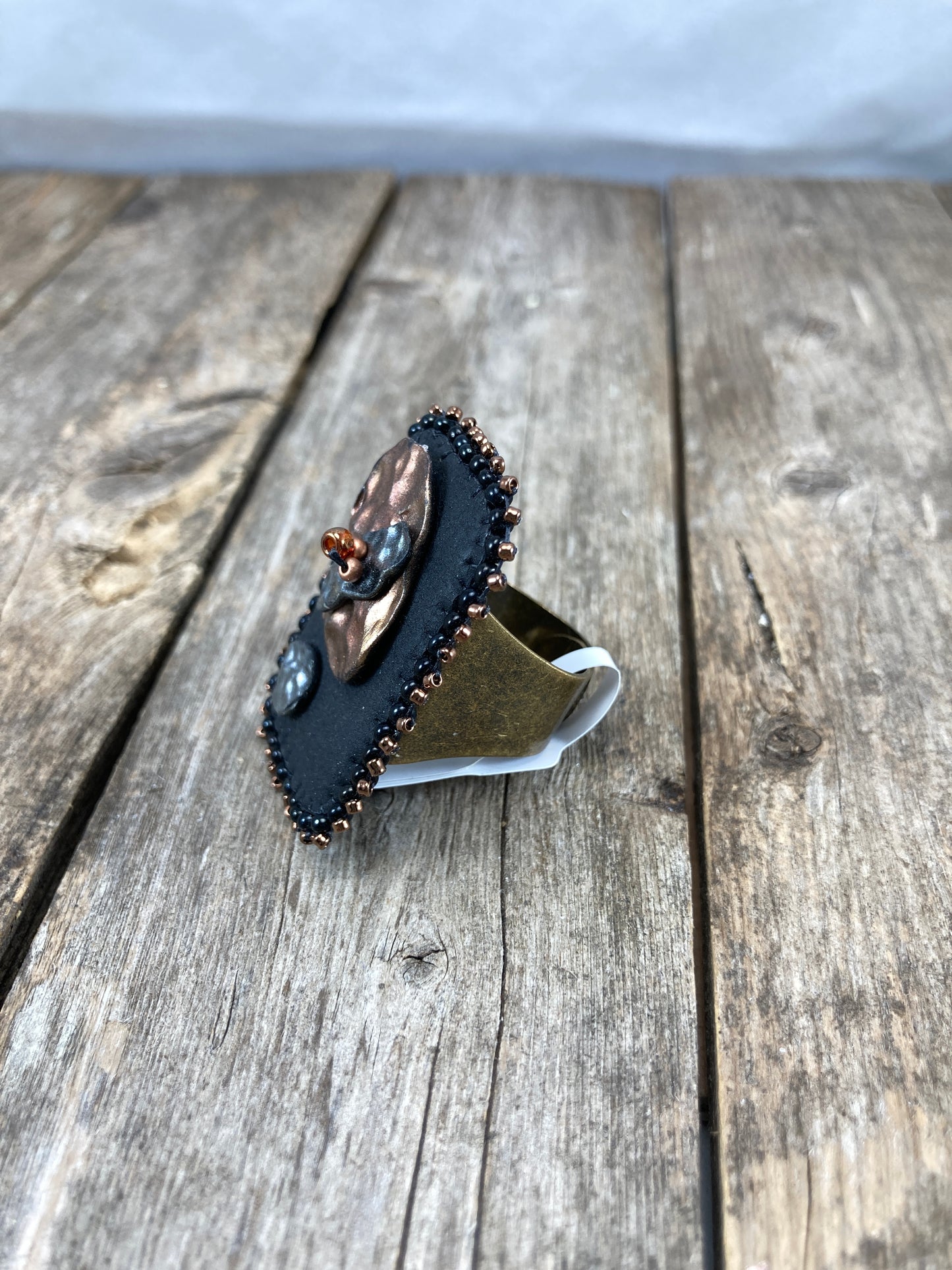 Rectangle statement ring with abstract hammered copper and silver clay with dark gold beaded edge