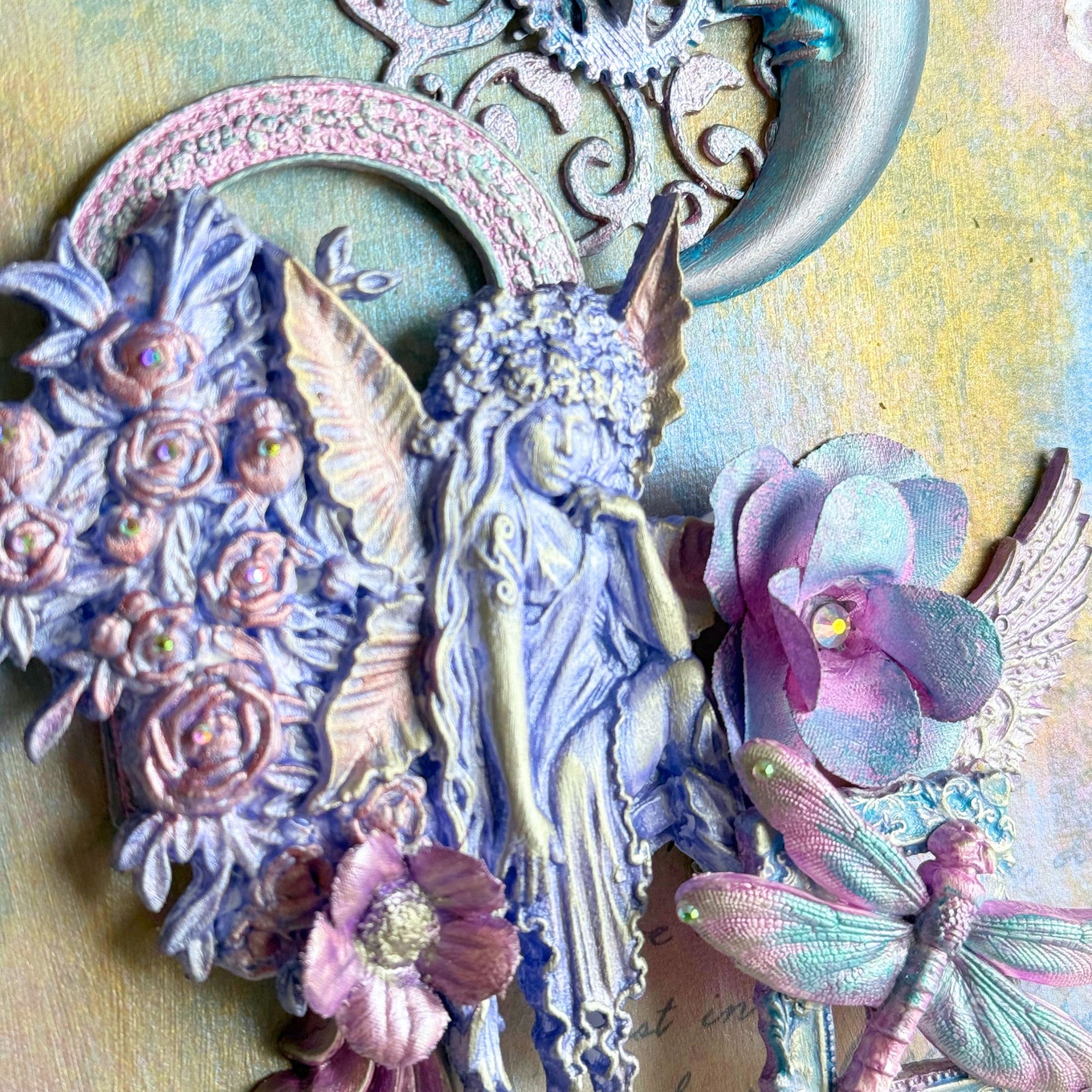 Decorative elements with fairies, flowers, and a moon on a textured background
