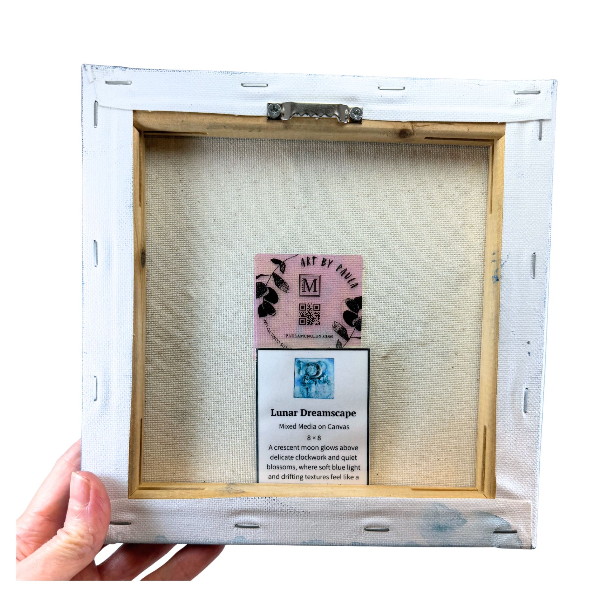Unframed artwork with a label inside the white frame
