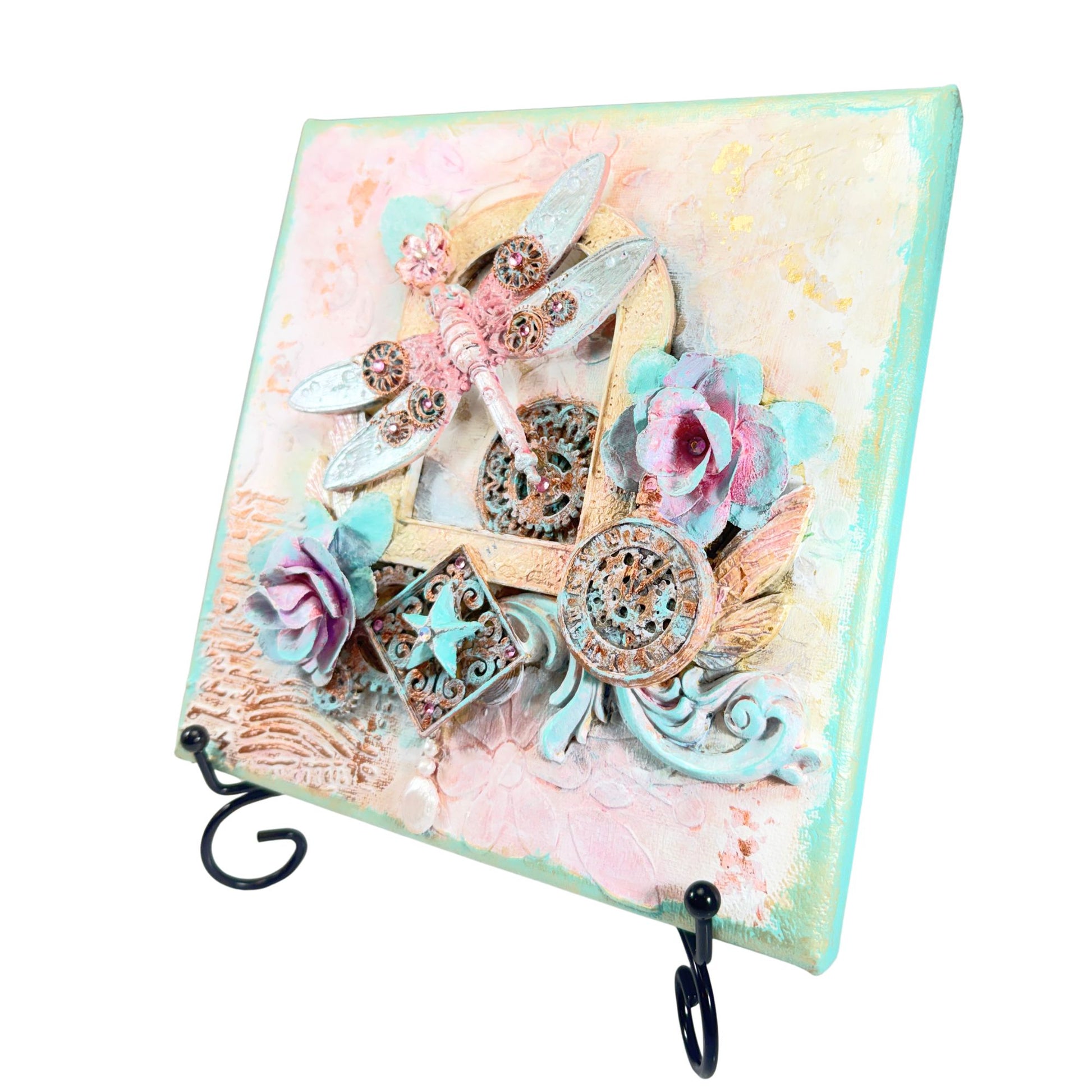 Decorative wall hook with floral and dragonfly design on a pastel background