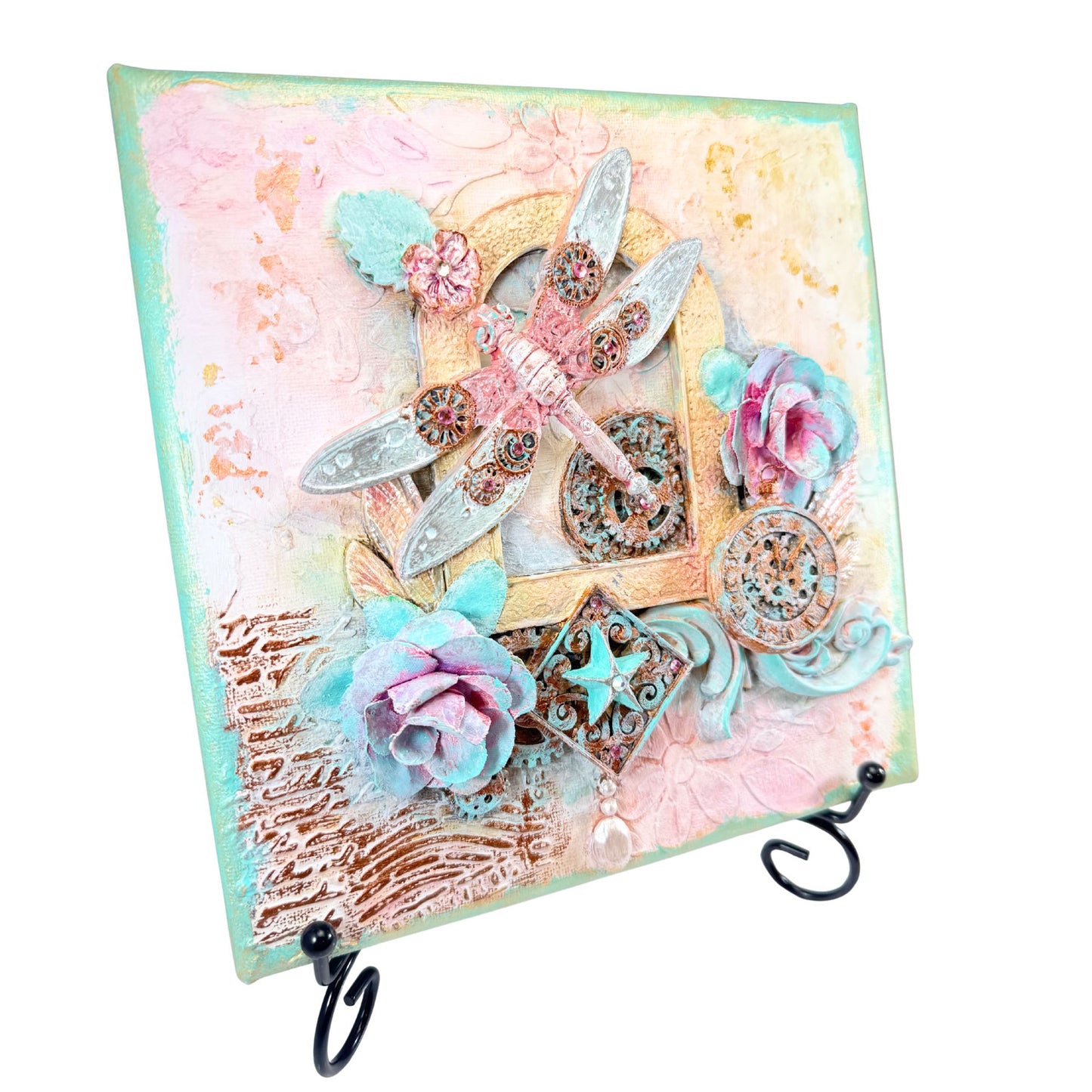 Decorative wall art with flowers, dragonflies, and decorative elements on a pastel background.