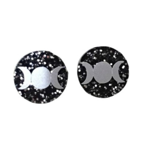 Round Triple moon acrylic stud earrings with silver glitter on a white background