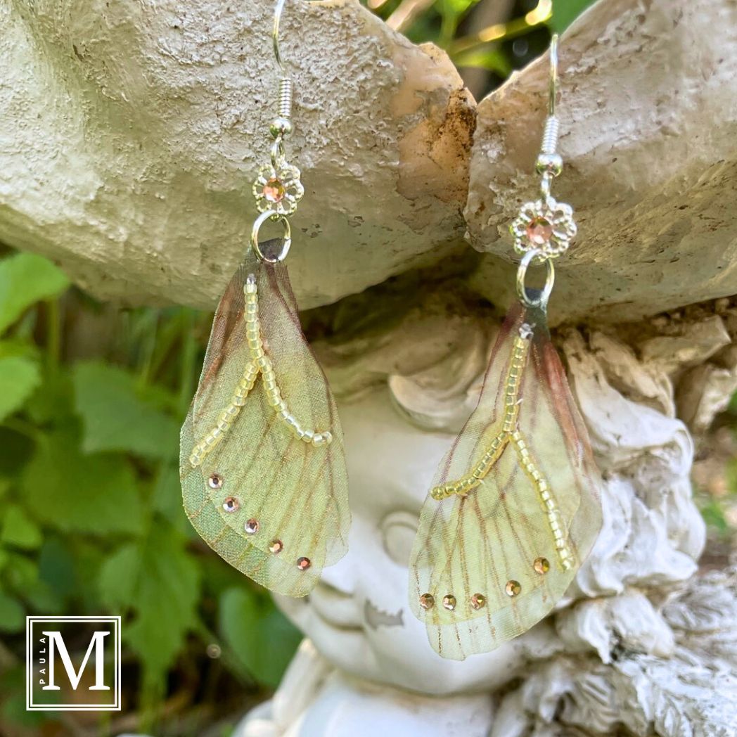 Yellow sheer fabric beaded butterfly wing earrings with peach color crystals and a flower bead connect the wings to the ear wires.