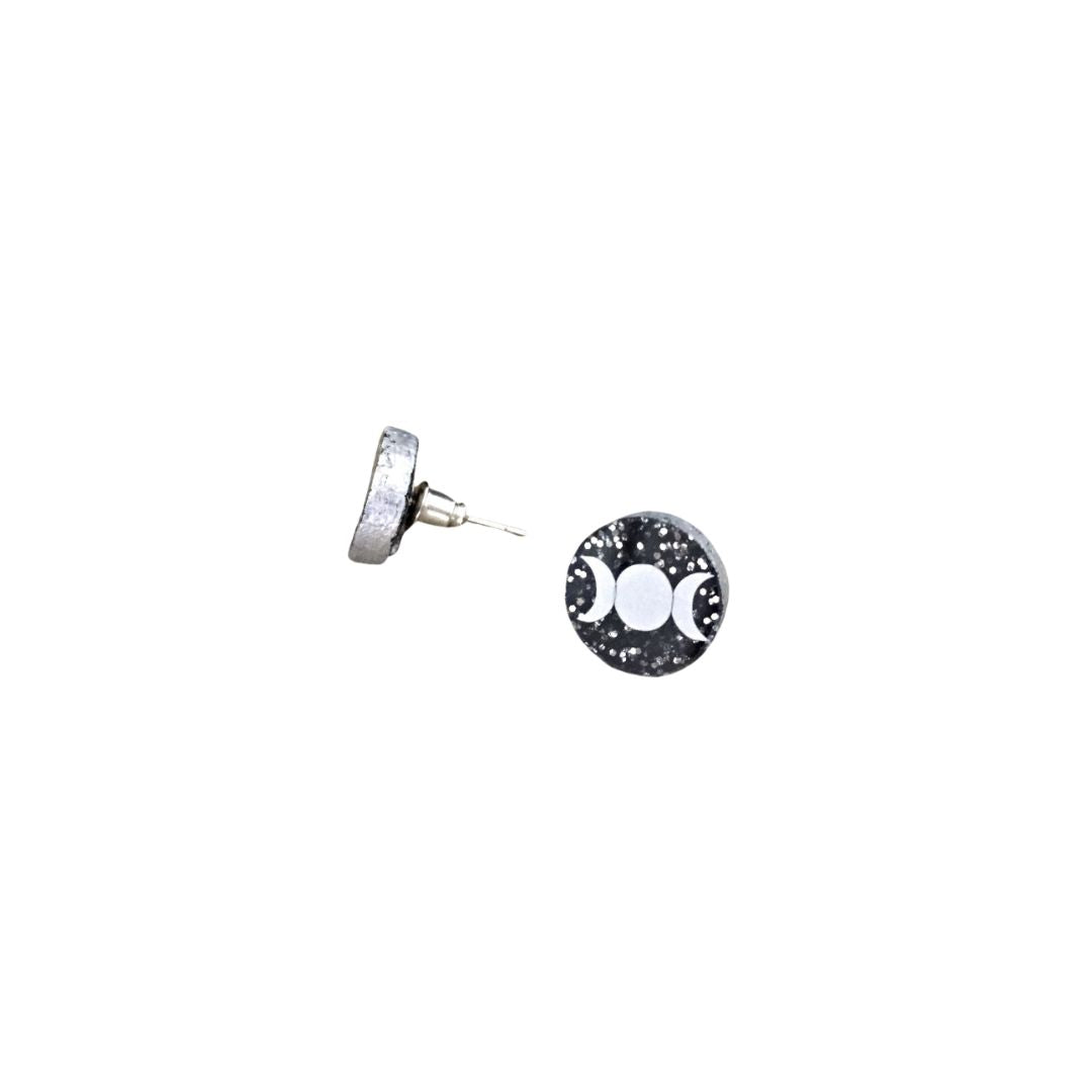 Round Triple moon acrylic stud earrings with silver glitter on a white background one with a side profile.