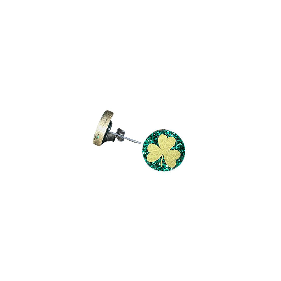 Green round glitter acrylic earrings with gold shamrock one with a side profile.