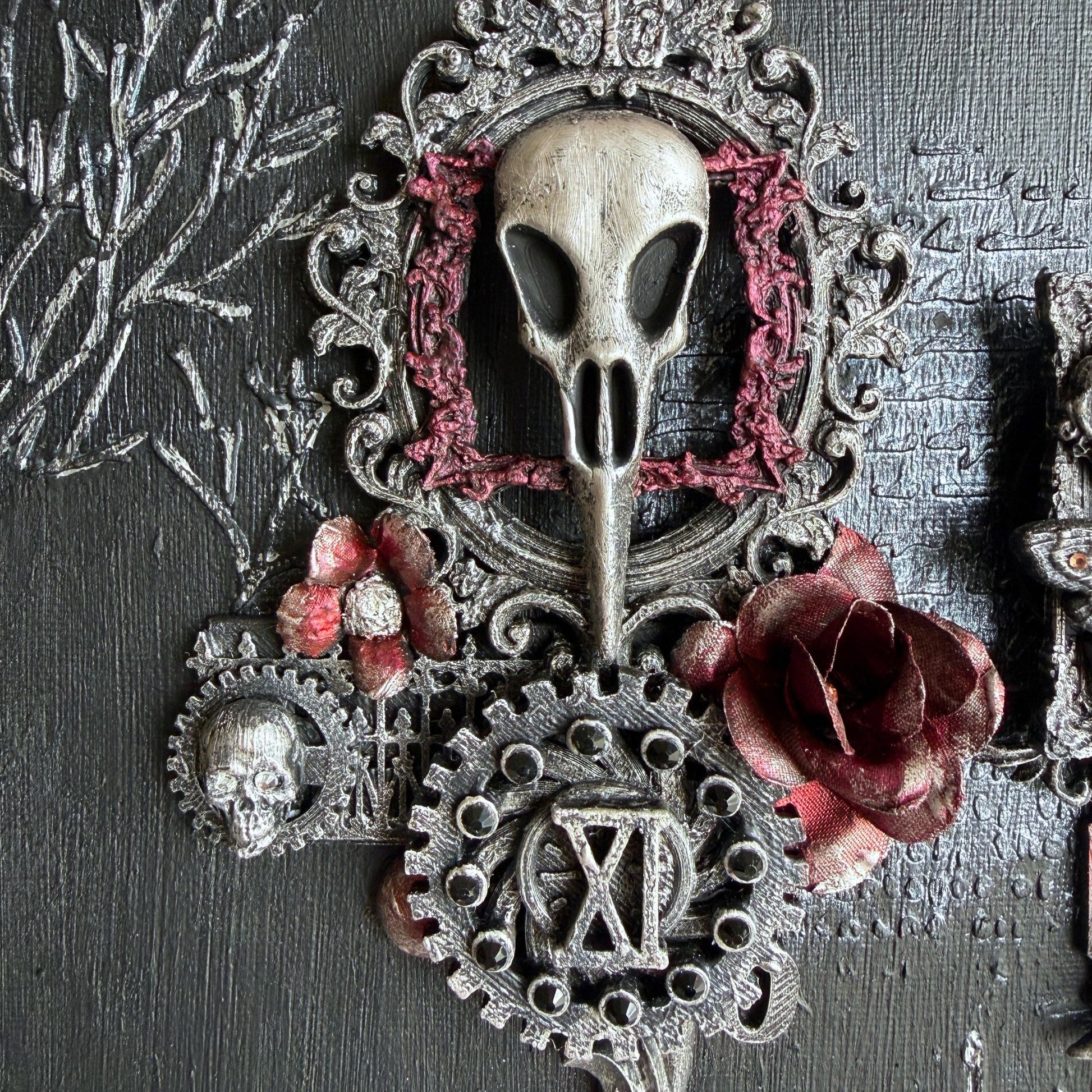 Decorative item with skull, gears, and flowers on a textured background