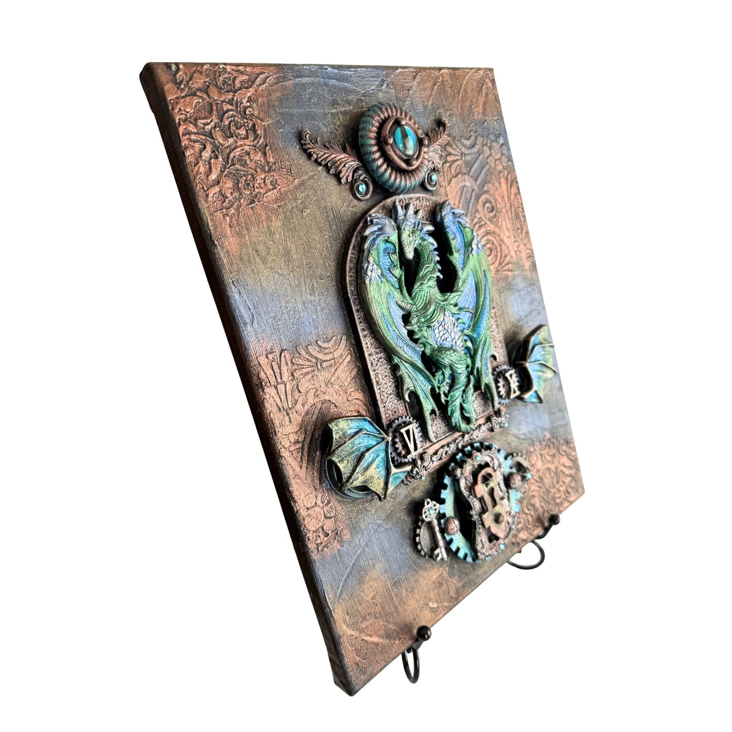 Decorative wall hook with owl design on a textured background