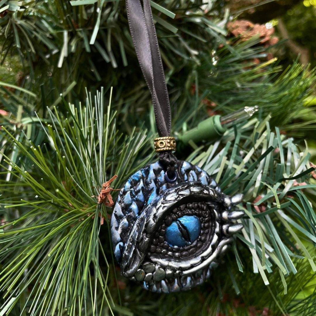 Decorative eye ornament hanging on a Christmas tree