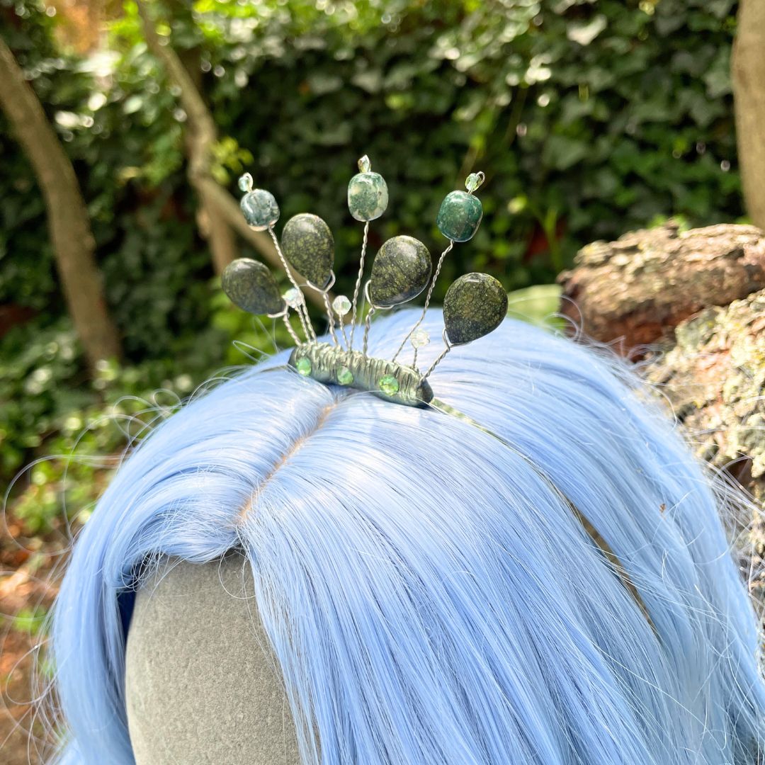 Side profile of forest nymph headband tiara on model with a blue wig in a forest setting.