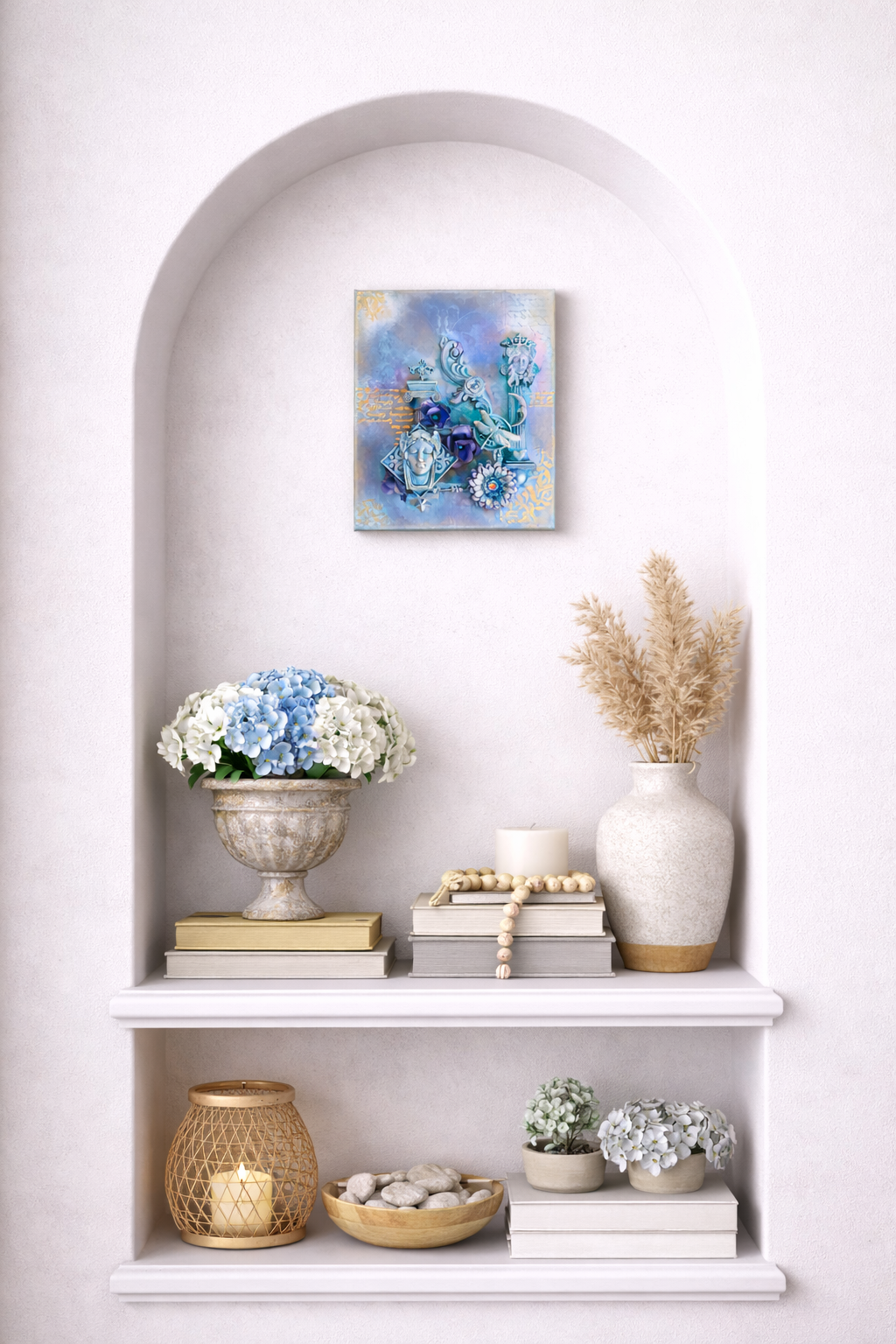Decorative shelf with books, candles, and floral arrangements against a white wall.