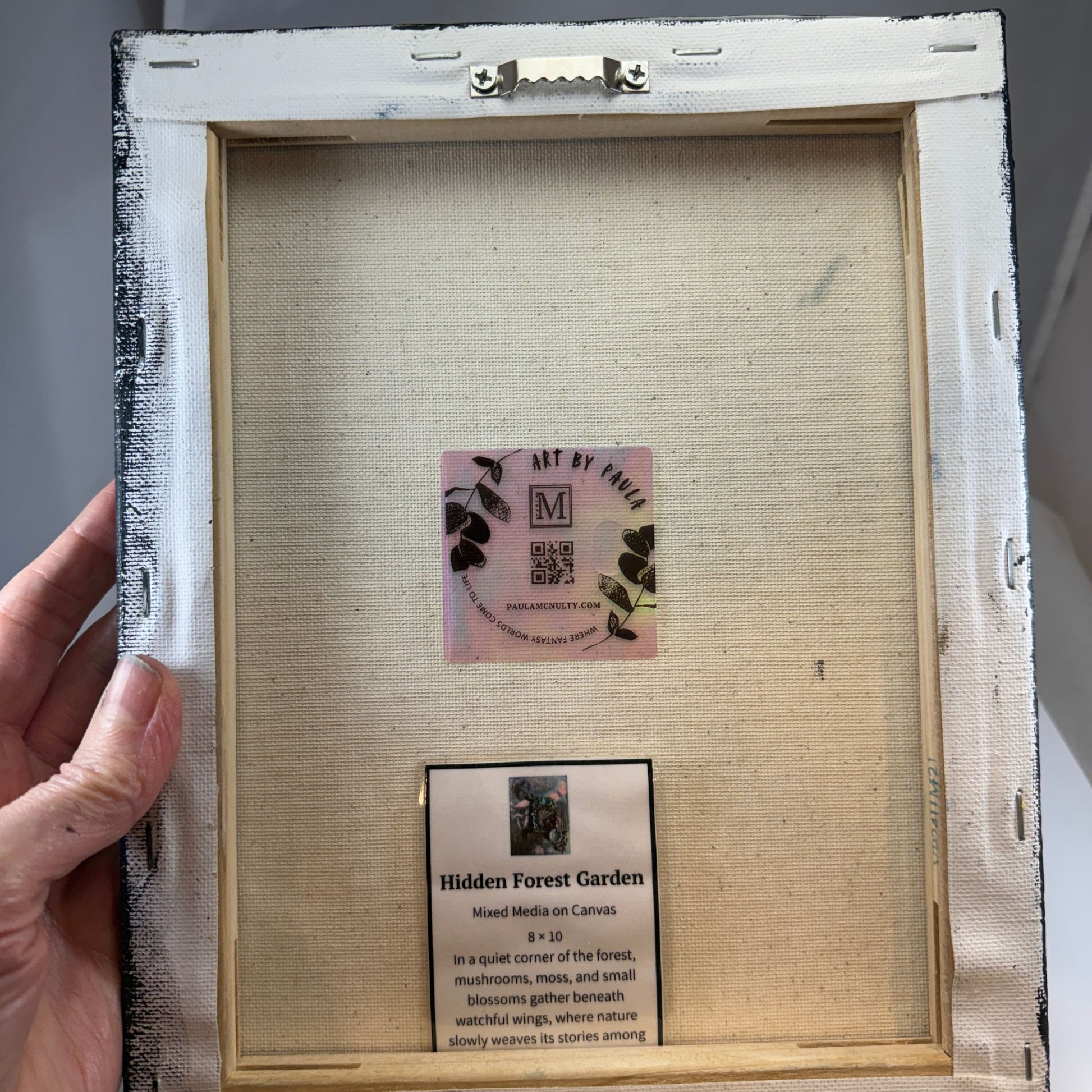 Framed artwork with a label inside the frame