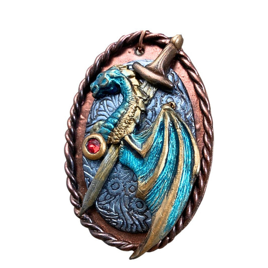 Handmade fantasy dragon and sword pendant necklace in teal, bronze, and bronze tones. High fantasy jewelry gift for dragon lovers and cosplay fans.