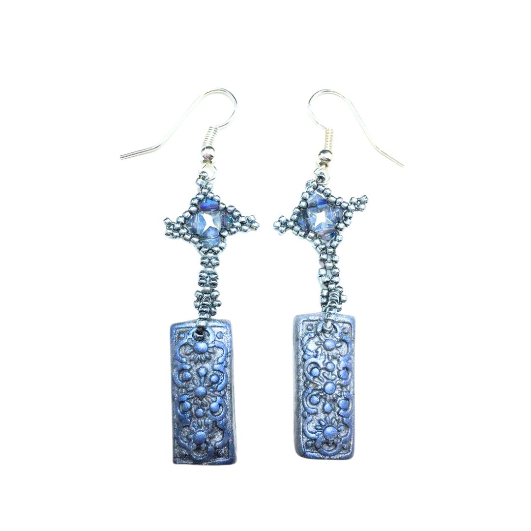 Pair of blue beaded earrings on a white background