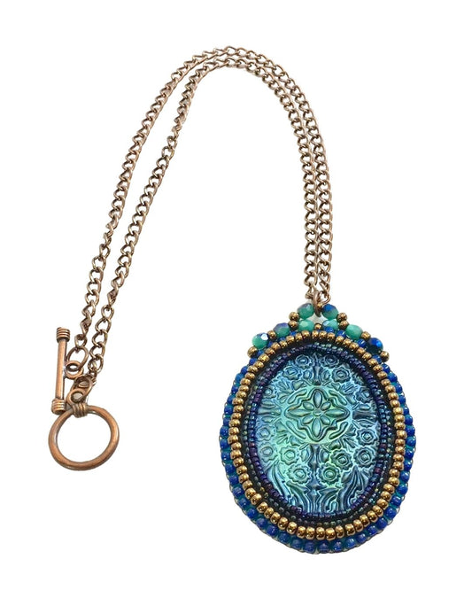 Blue medieval floral necklace on white background