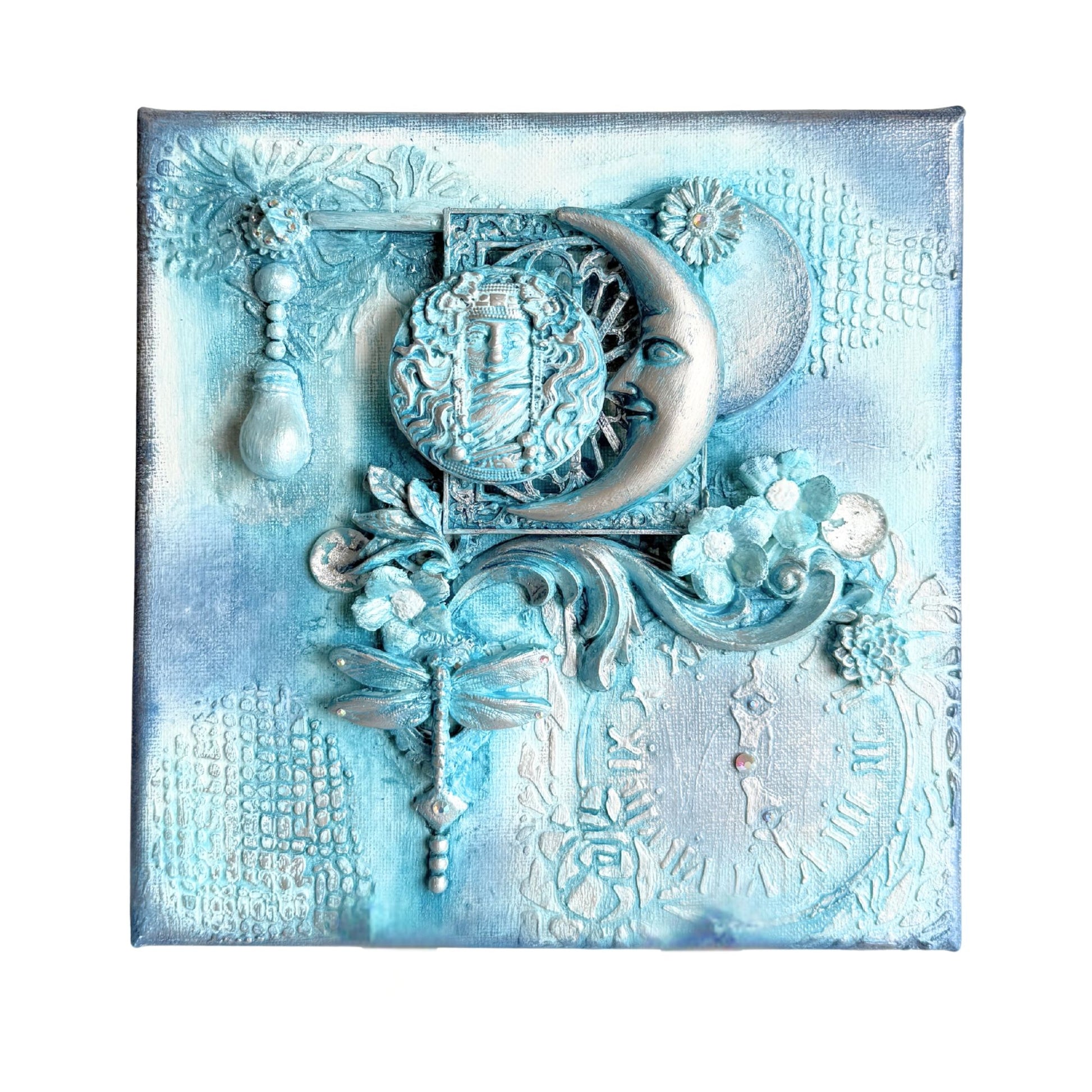 Decorative wall art with floral and celestial design in blue and white tones.