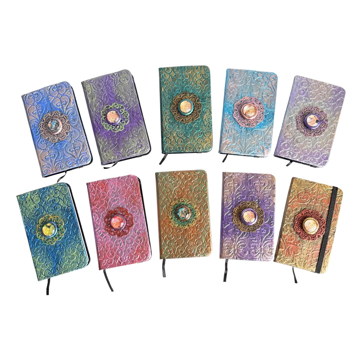 Set of colorful notebooks with decorative covers on a white background