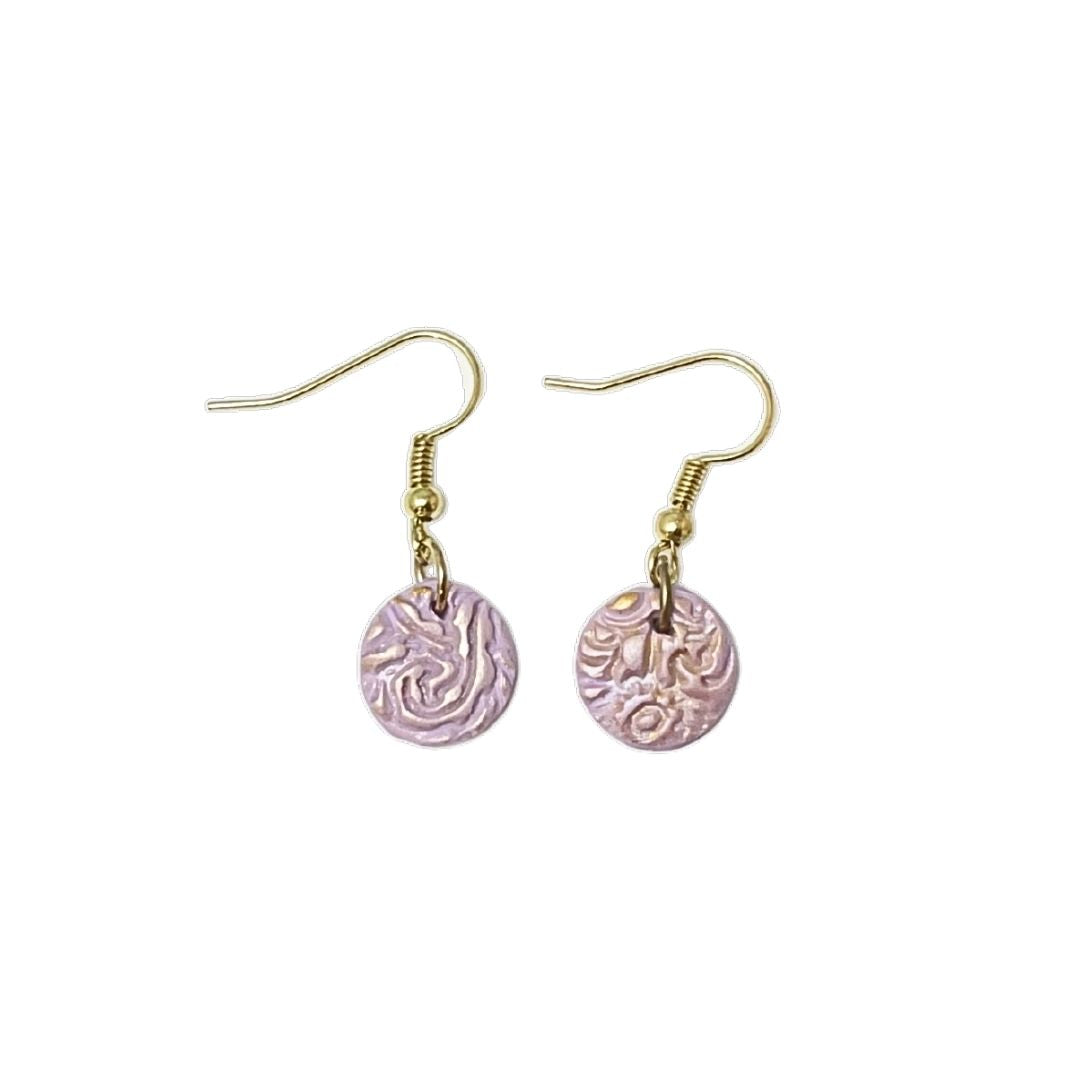 Small texture purple clay earrings on a white background