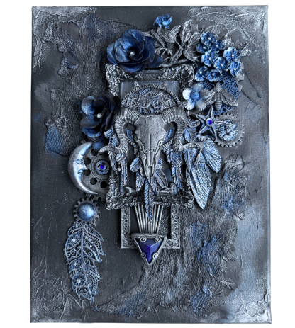 Decorative wall art with intricate designs, blue flowers, and metallic elements on a textured gray background.