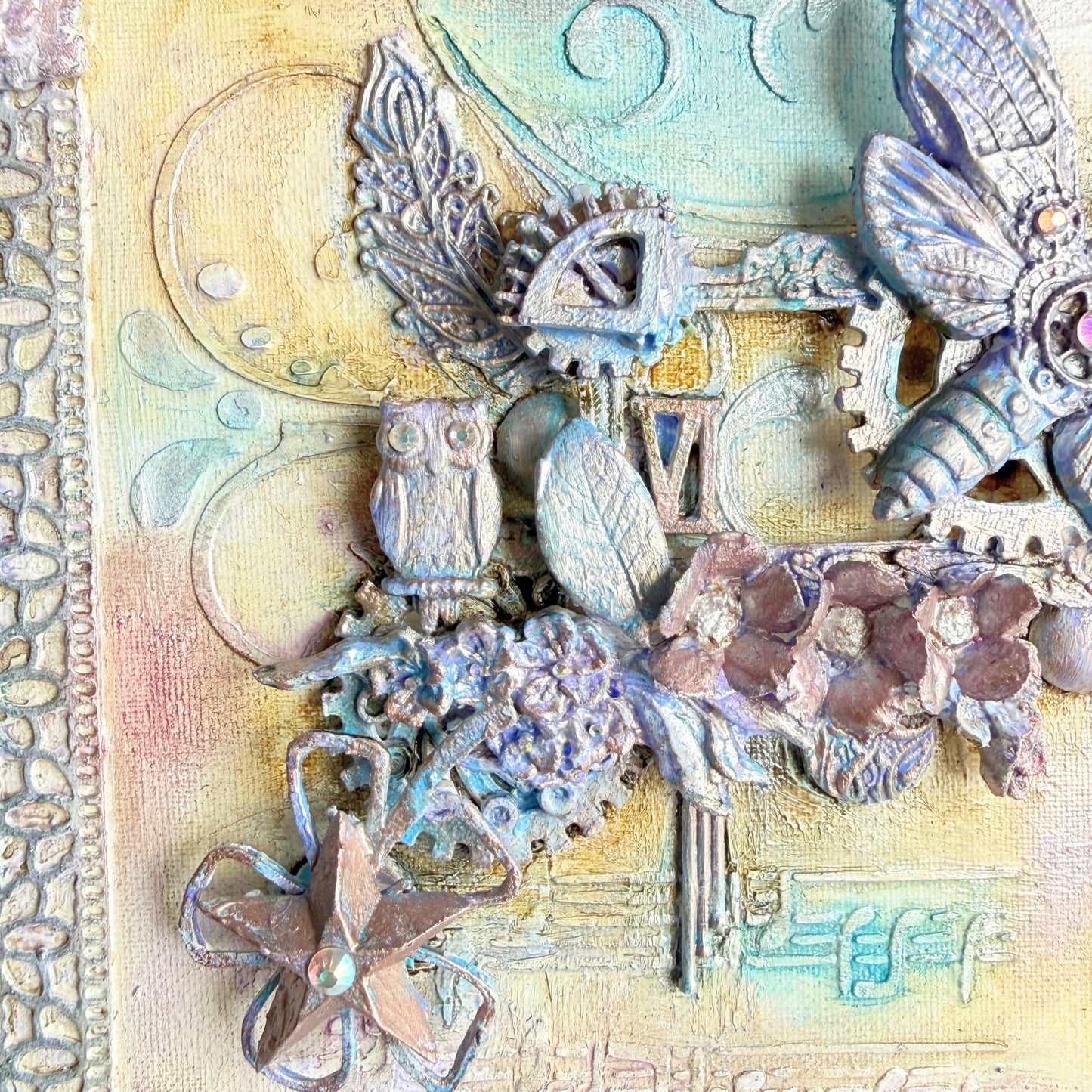 Decorative collage with butterflies, flowers, and gears on textured paper.