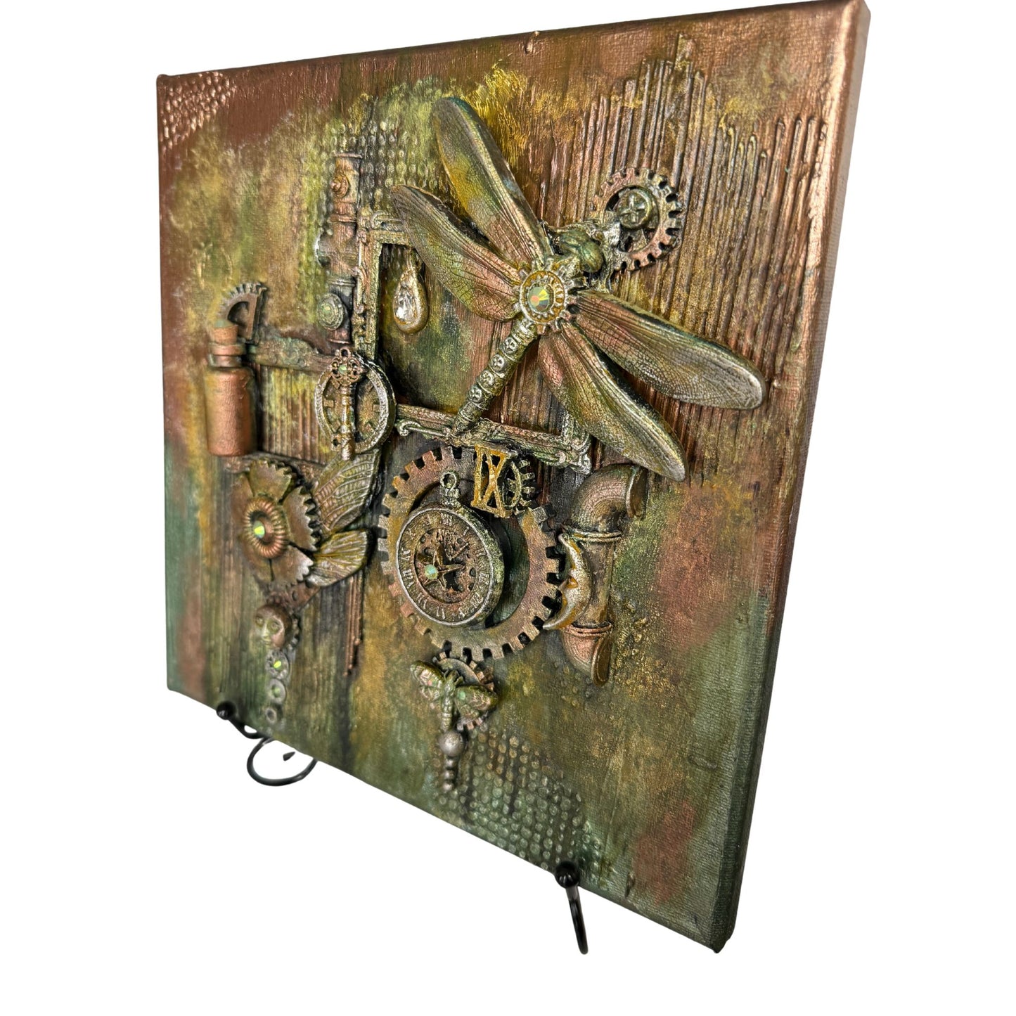 Decorative panel with steampunk design featuring gears, a dragonfly, and pipes on a textured background.