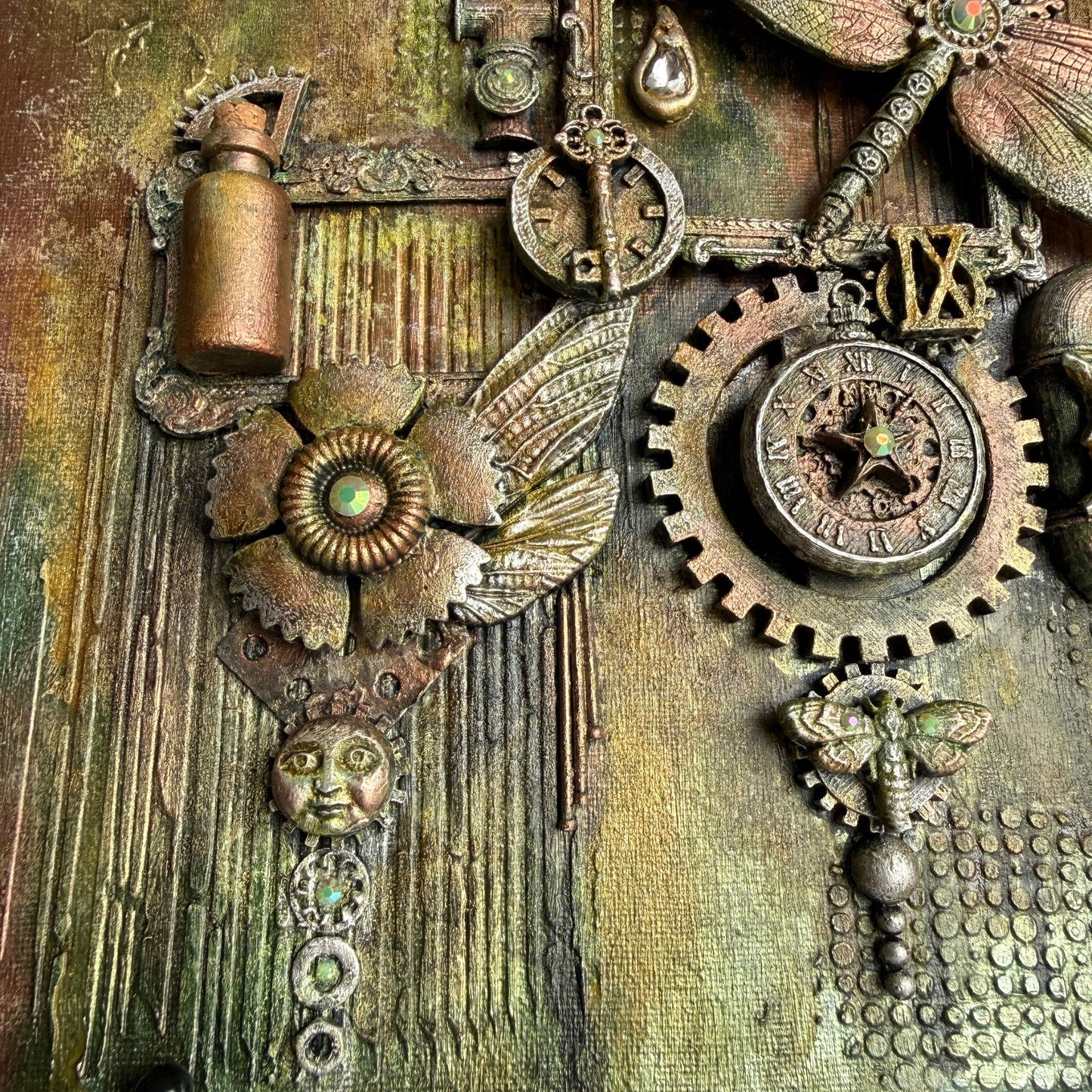 Close-up of steampunk-style jewelry with gears, clocks, and mechanical elements on a textured background.