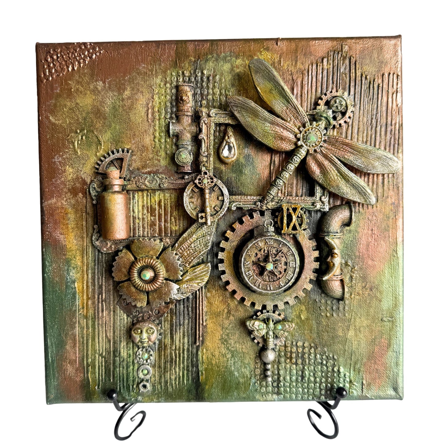 Decorative wall art with steampunk elements, gears, and dragonflies on a textured background.