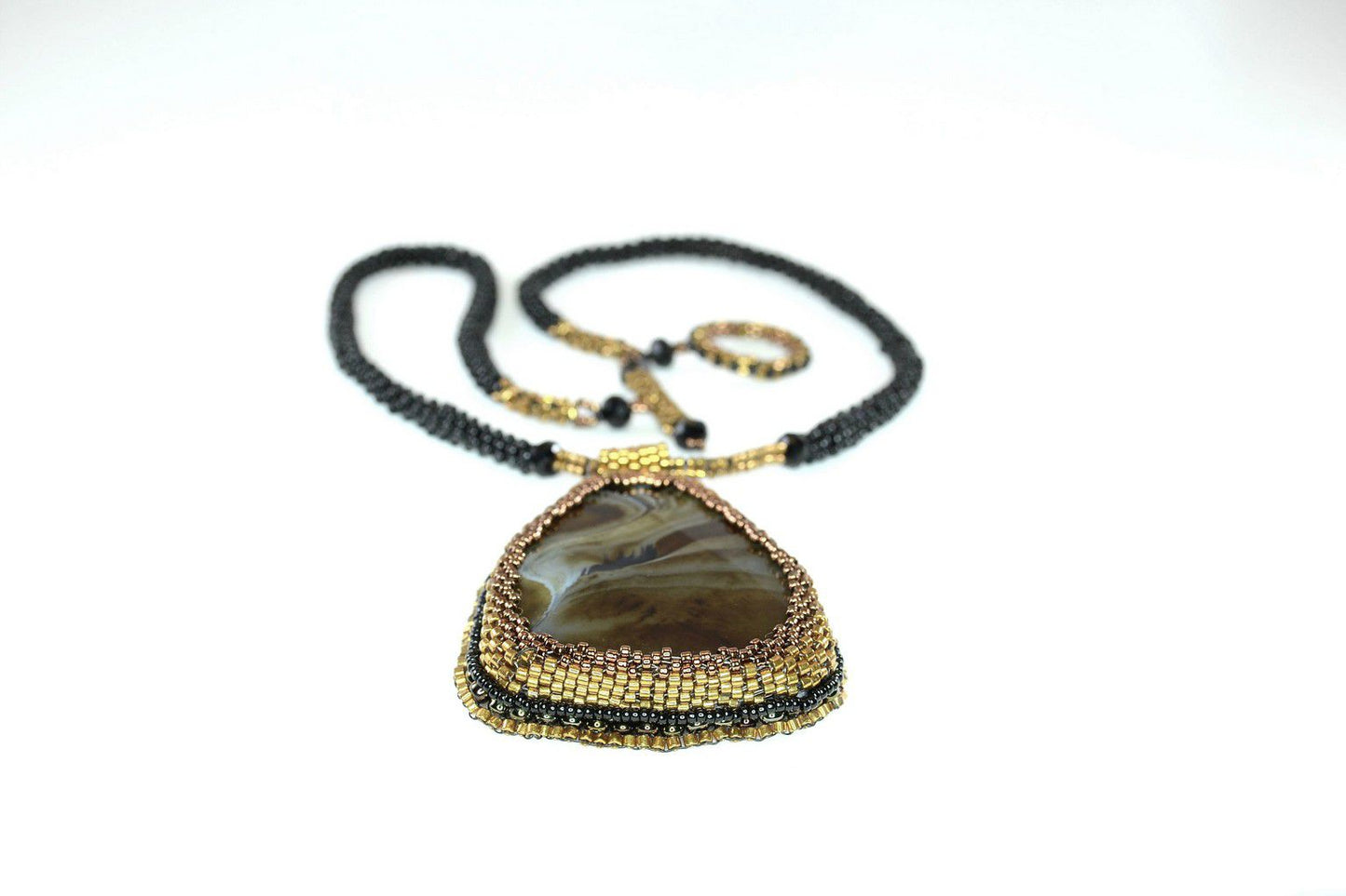 Stunning faceted agate statement necklace with gold beaded bezel and fully beaded chain in black and gold