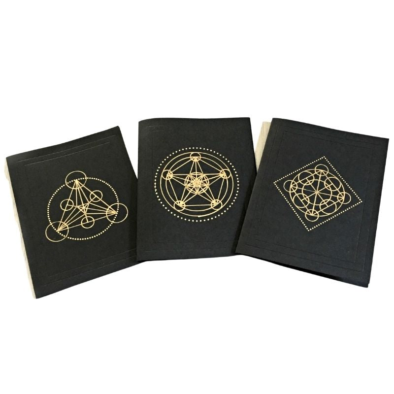 Black alchemy cards with gold ink geometric shapes