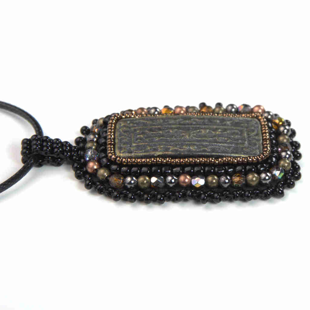 black and bronze rectangular pendant with awesome awesome polymer clay black beaded fringe