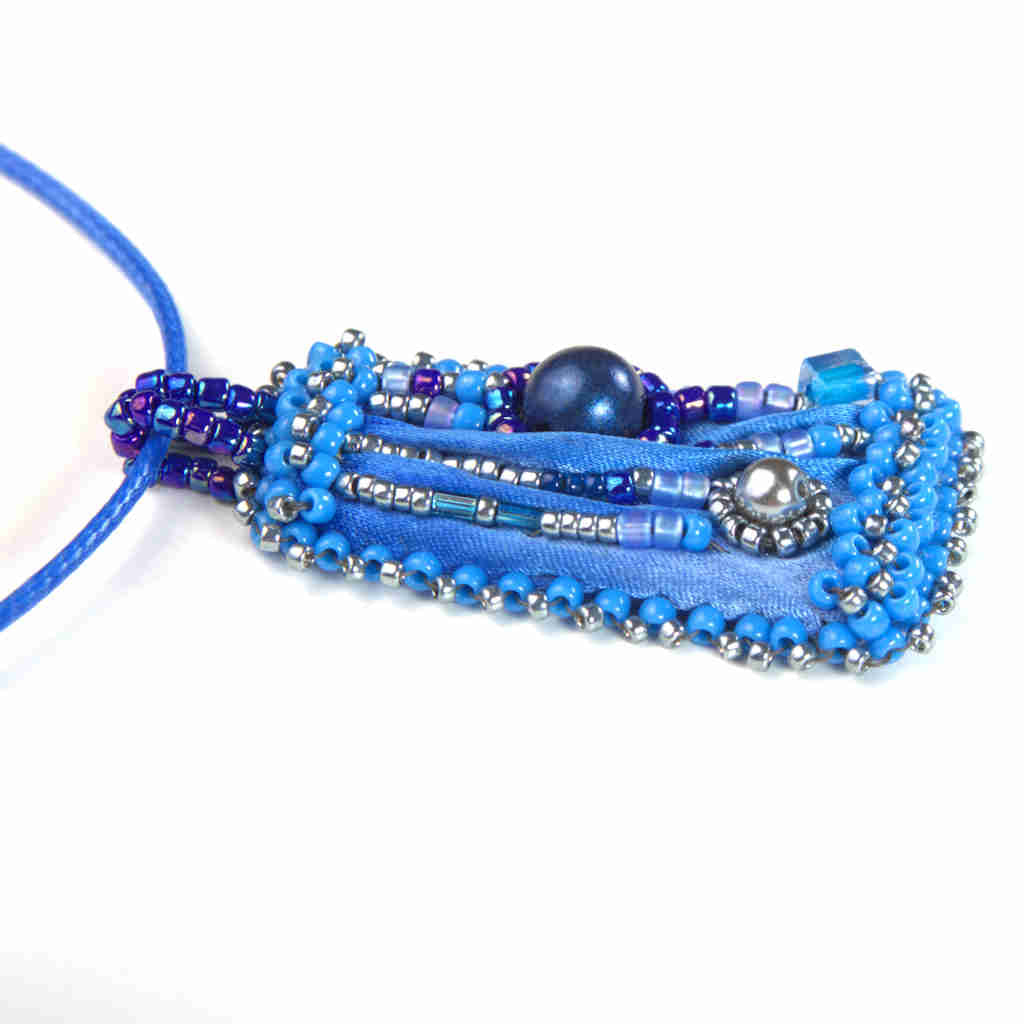 Blue shibori silk and beaded pendant left