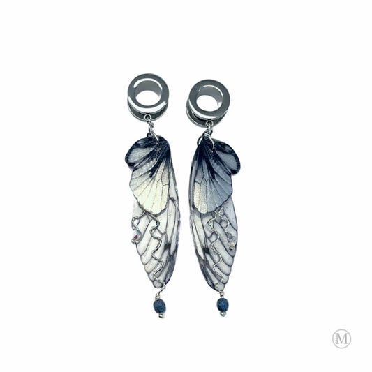 Double fairy wing earrings in silver with ear tunnels for stretched ears.