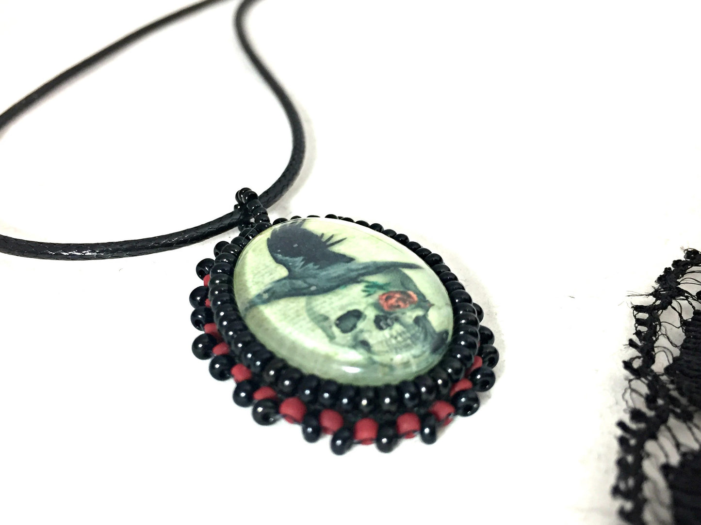 skull raven and rose pendant at angle
