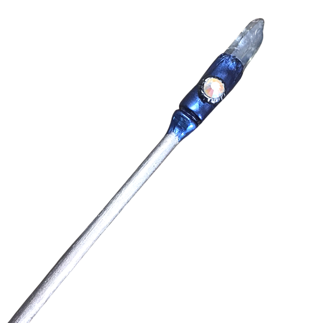 Silver painted wooden hair stick with blue luster quartz crystal at one end and blue clay detail featuring a flat crystal.