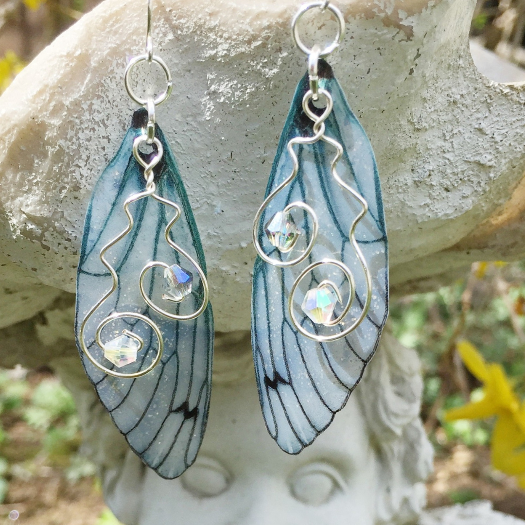 sterling silver blue gray wing earrrings with silver wire crystal swirl detail.