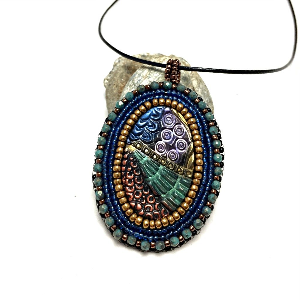 zentangle pendant with green crystals