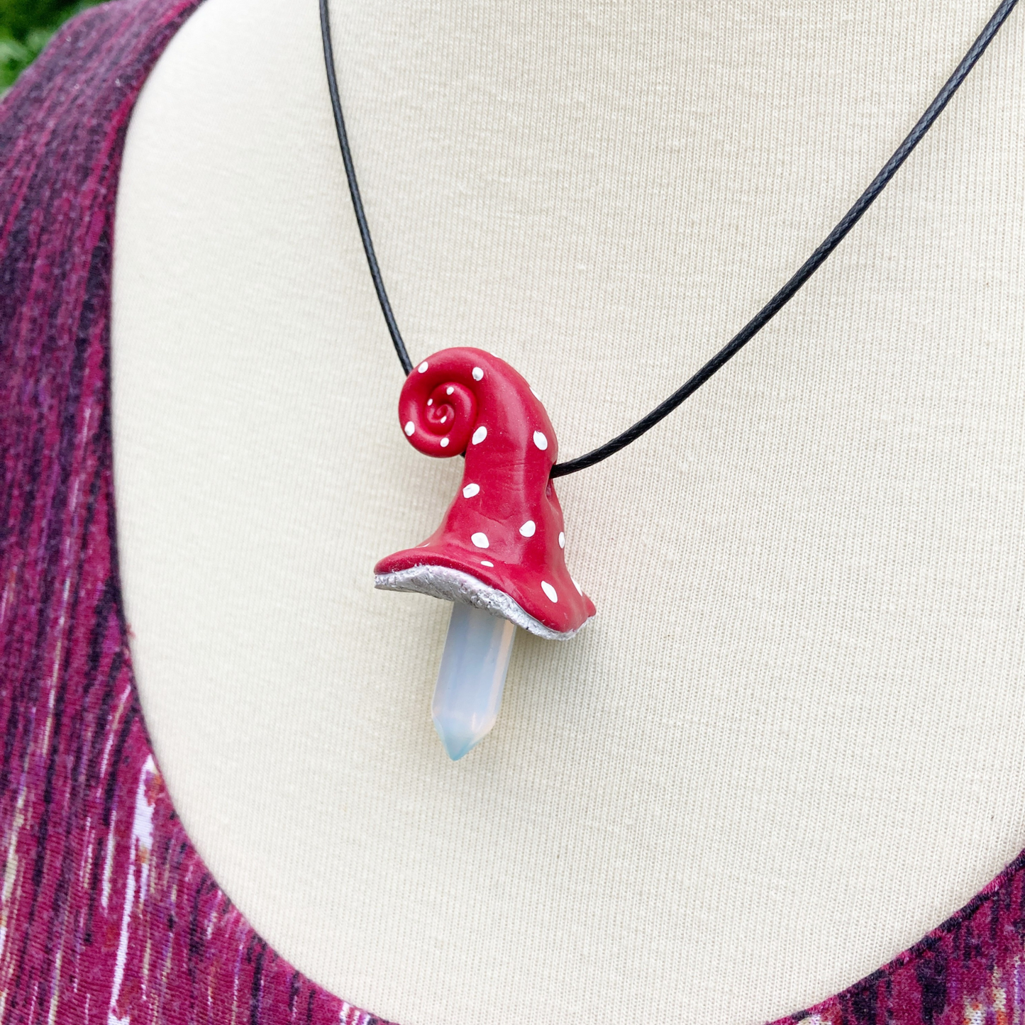 Amanita Muscaria Mushroom necklace made from polymer clay on a black cord necklace