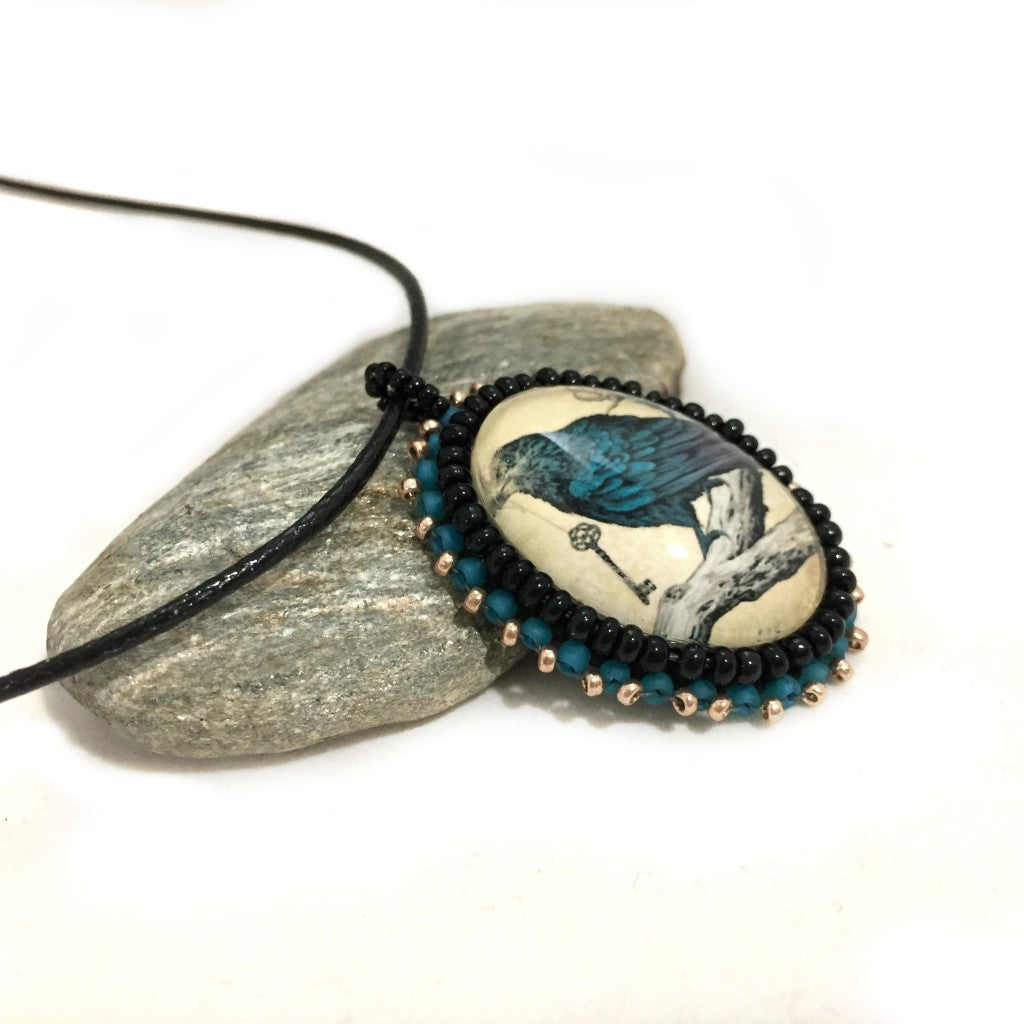 blue raven pendant left side