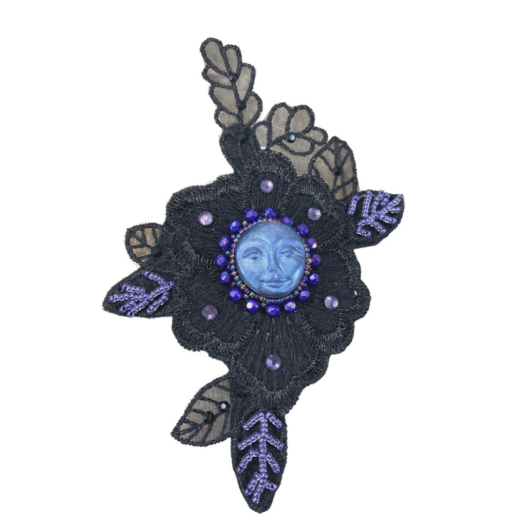 Blue moon face with purple beading on black lace applique hair clip