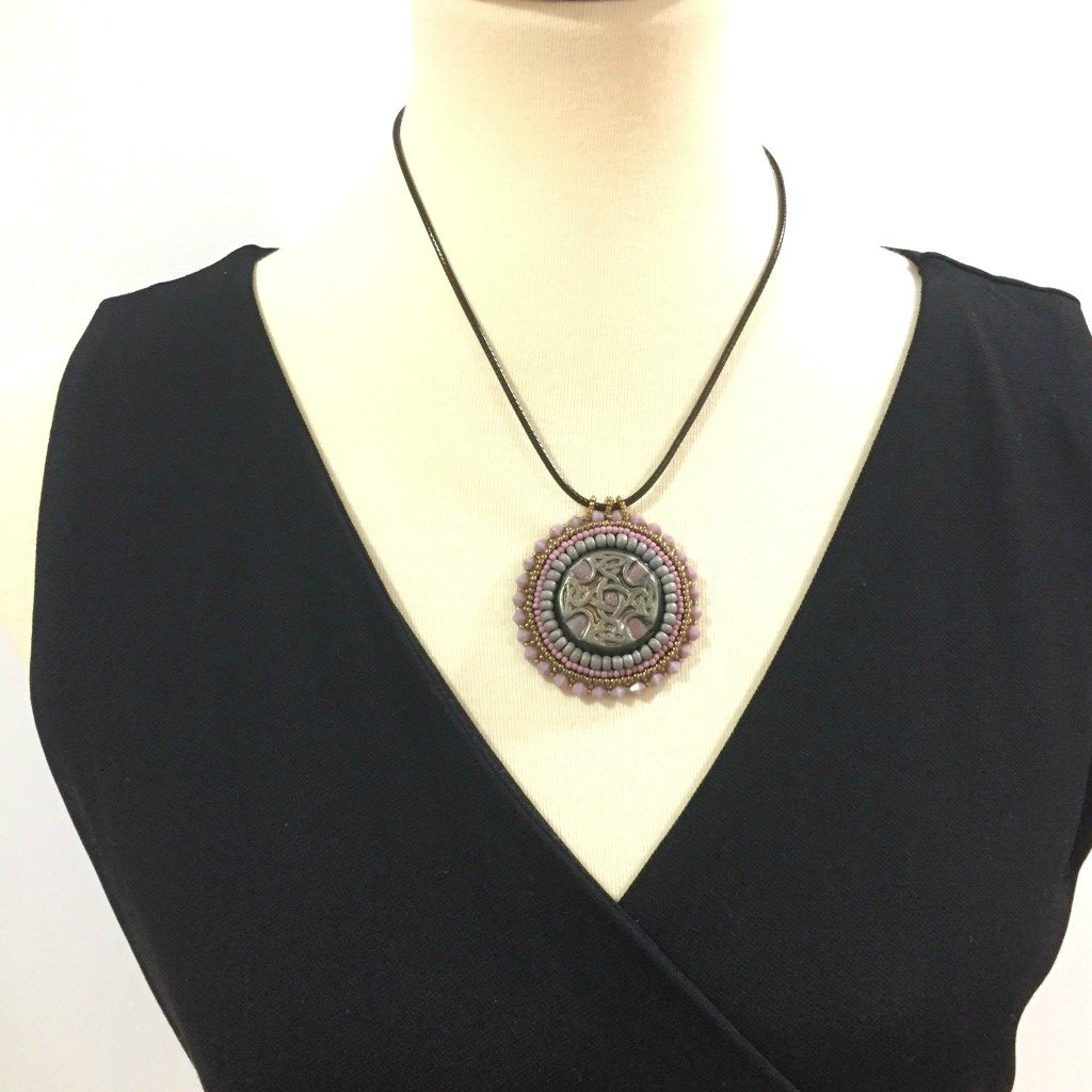 Celtic cross necklace on mannequin