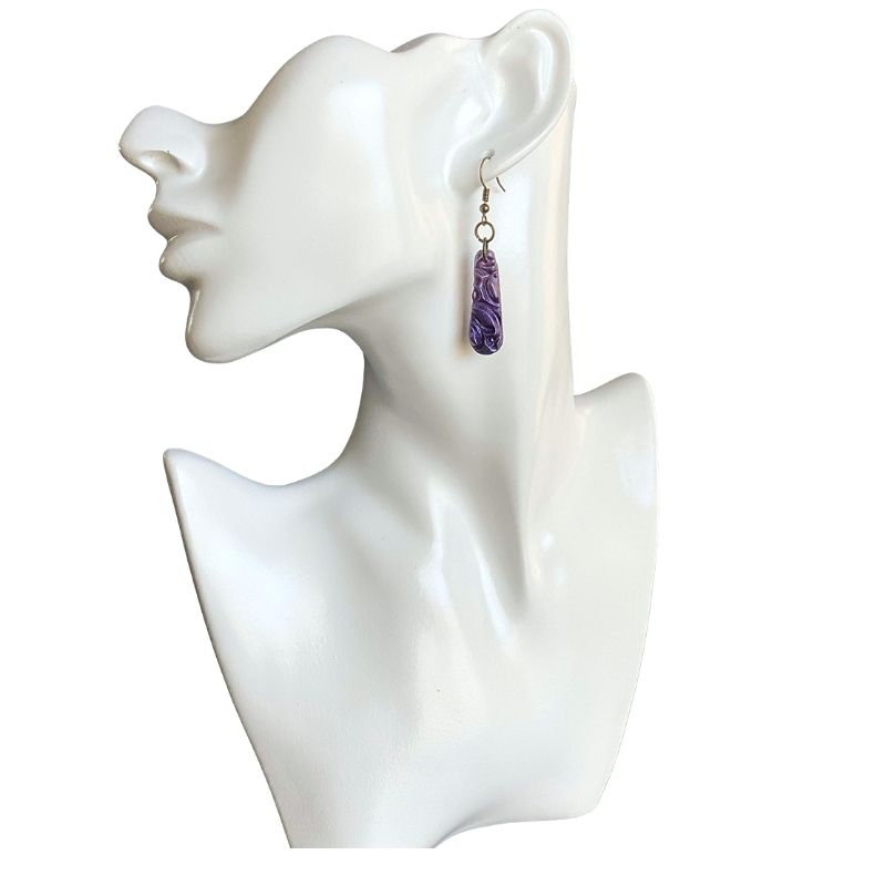 purple floral drop earrings on model