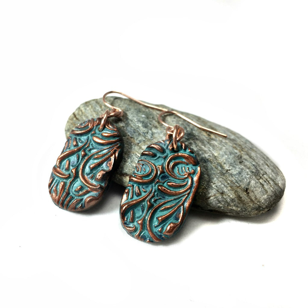 side view of copper patina earrings