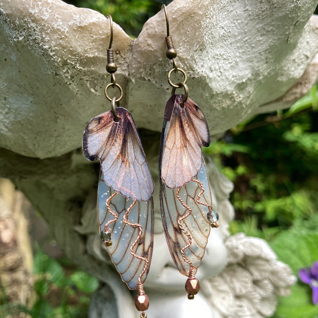 Brown and translucent butterfly wing earrings with copper wired crystals and antique bronze ear wires.