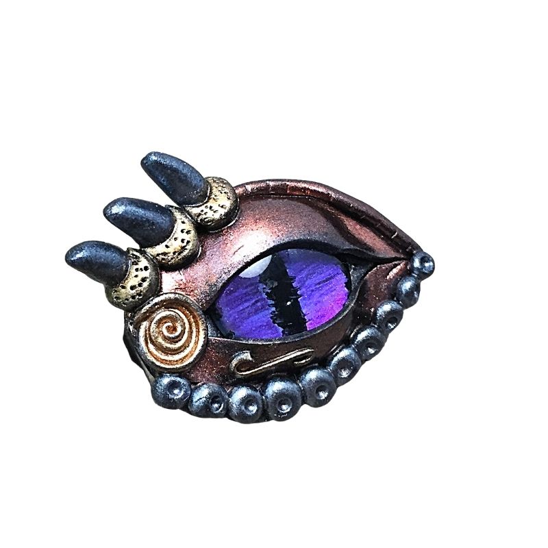 dragon ey brooch pin with a blue an purple eye