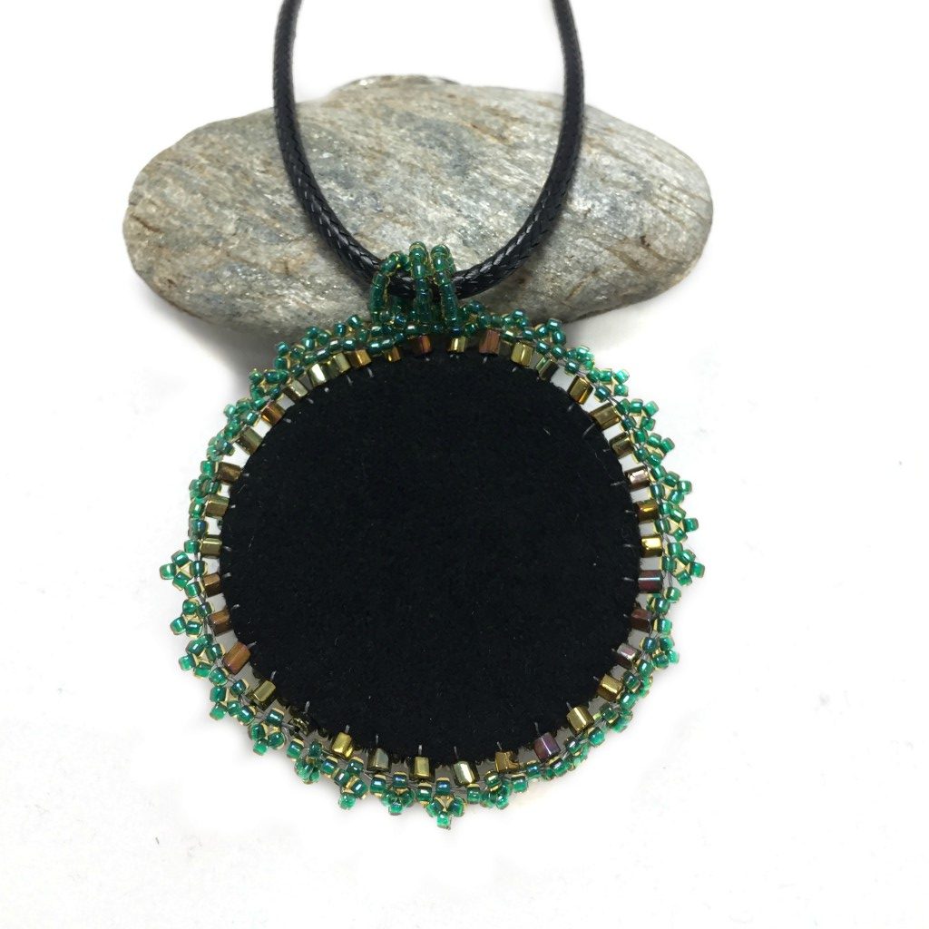 Emerald cross back of pendant